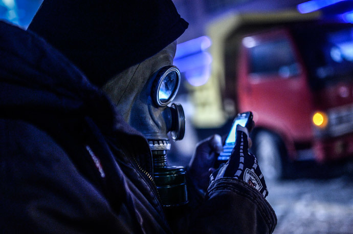 This March 11, 2014 file photo shows a protestor looking at his cell phone screen in Istanbul. (AFP Photo / Bulent Kilic)