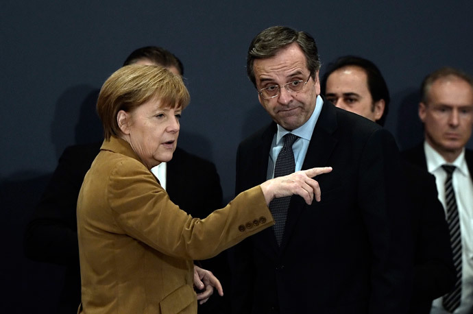 German Chancellor Angela Merkel talks with Greece's Prime minister Antonis Samaras (R) upon their arrival for a meeting with Greek young businessmen in a hotel in Athens on April 11, 2014. (AFP Photo / Louisa Gouliamaki)
