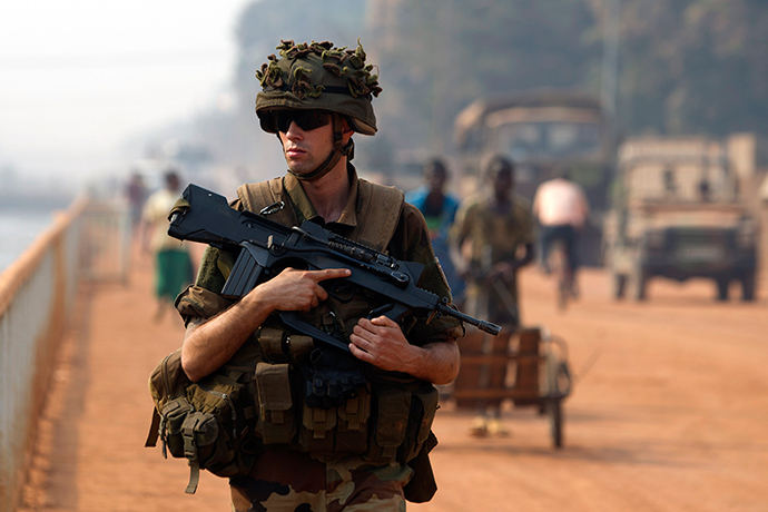 A French peacekeeping soldier patrols a street of the capital Bangui January 18, 2014 (Reuters / Siegfried Modola)