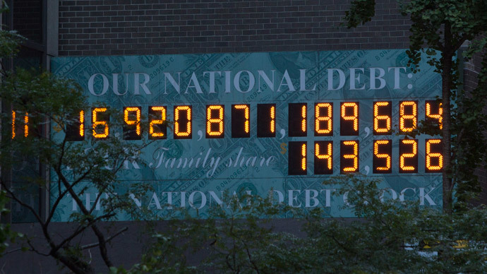The national Debt Clock is seen in New York October 15, 2013. (Reuters / Andrew Kelly)