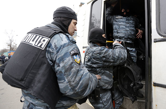 Members of Berkut anti-riot unit embark in a bus as leave their barracks in Kiev February 22, 2014. (Reuters / Yannis Behrakis)