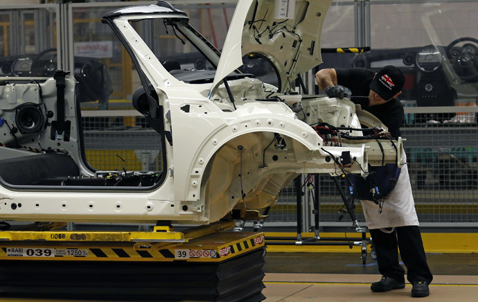 An employee works on a 2013 Mini at BMW's plant in Oxford, southern England (Reuters/Suzanne Plunkett)