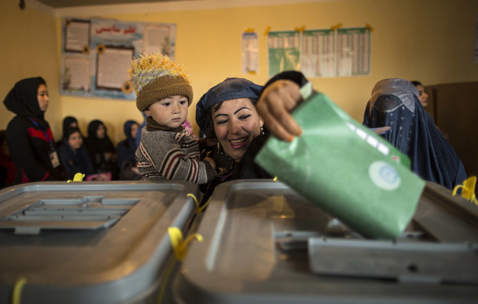 An Afghan woman casts her ballot at a polling station in Mazar-i-Sharif April 5, 2014. (Reuters/Zohra Bensemra)