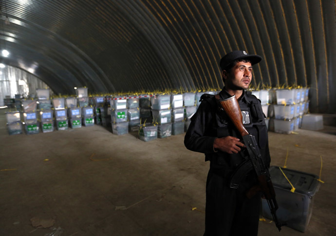 An Afghan policeman stands guard at a counting centre in Kabul April 6, 2014. (Reuters)