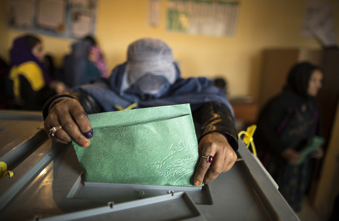 An Afghan woman casts her ballot at a polling station in Mazar-i-Sharif April 5, 2014. (Reuters)