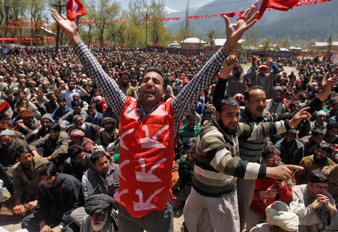 A supporter of Kashmir's ruling National Conference (NC) party, wearing a vest with images of ploughs, shouts slogans during an election campaign rally being addressed by Farooq Abdullah, the president and a candidate of NC, in Kangan, east of Srinagar, April 28, 2014. (Reuters / Danish Ismail)