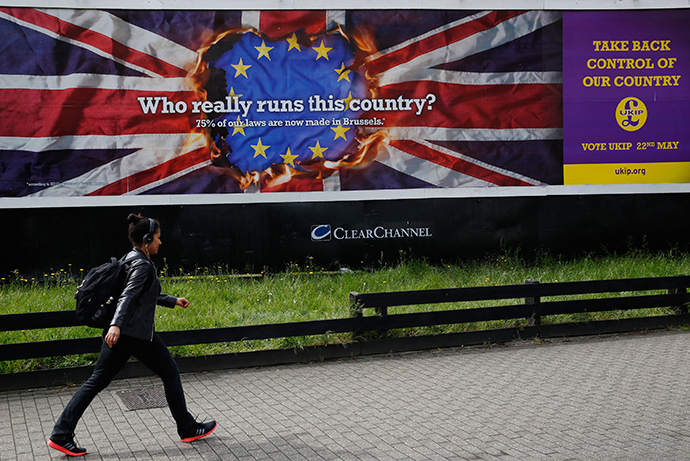 A pedestrian passes a United Kingdom Independence Party (UKIP) European elections campaign poster in Vauxhall, central London April 22, 2014 (Reuters / Luke MacGregor)