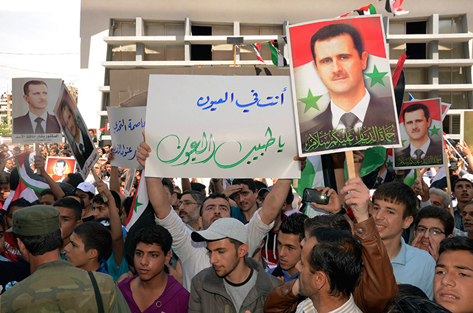 Supporters of Syria's President Bashar al-Assad take part in a rally showing support a day after he declared that he would seek re-election in June, in Aleppo April 29, 2014 (Reuters)