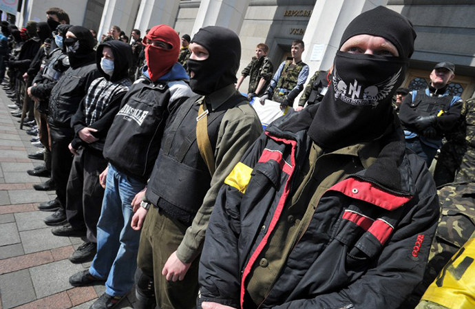 Supporters of the right wing party Pravyi Sector (Right Sector) protest in front of the Ukrainian Parliament in Kiev on March 28, 2014. (AFP Photo / Genya Savilov)