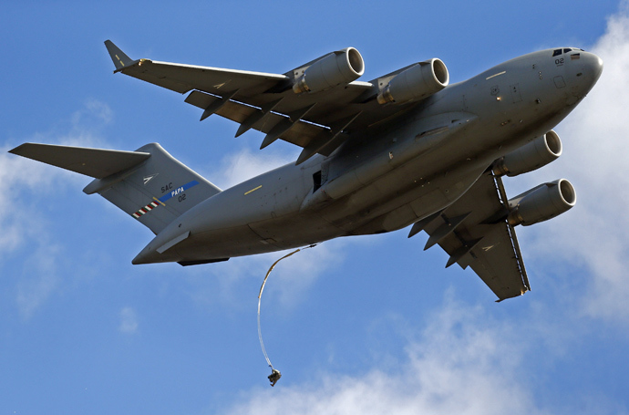 A soldier from the U.S. Army's 173rd Infantry Brigade Combat Team parachutes from a Boeing C-17 Globemaster III during a NATO-led exercise "Orzel Alert" held together with Canada's 3rd Battalion and Princess Patricia's Light Infantry, and Poland's 6th Airborne Brigade in Bledowska Desert in Chechlo, near Olkusz, south Poland May 5, 2014 (Reuters / Kacper Pempel)