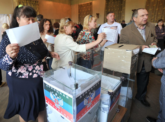 People cast their ballots in a polling station during a so-called referendum in the eastern Ukrainian city of Donetsk on May 11, 2014.(AFP Photo / Genya Savilov)