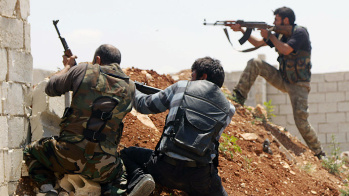 Free Syrian Army fighters take position during clashes with forces loyal to Syria's President Bashar al-Assad in Sheikh Najjar in Aleppo May 13, 2014. (Reuters/Hosam Katan)