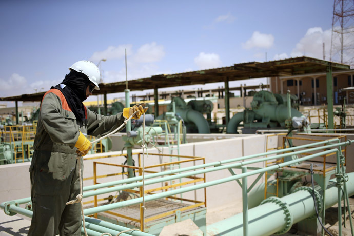A worker maintains oil pipelines at the Zueitina oil terminal in Zueitina, west of Benghazi April 7, 2014. (Reuters/Esam Omran Al-Fetori)