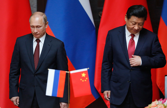 Russia's President Vladimir Putin (L) and China's President Xi Jinping attend an agreement signing ceremony during a bilateral meeting at Xijiao State Guesthouse ahead of the fourth Conference on Interaction and Confidence Building Measures in Asia (CICA) summit, in Shanghai May 20, 2014.(Reuters / Carlos Barria)