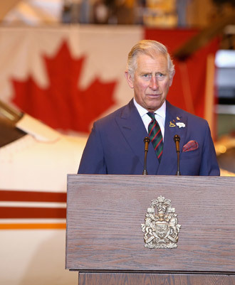 Prince Charles, Prince of Wales gives a speech as he visits Stevenson Campus Air Hanger on May 21, 2014 in Winnipeg, Canada.(AFP Photo / Chris Jackson)