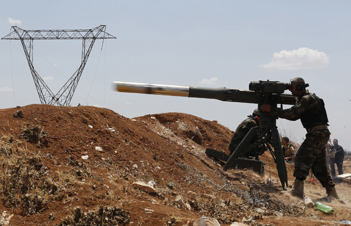 A Free Syrian Army fighter fires a weapon towards forces loyal to Syria's President Bashar al-Assad, in the town of Morek in Hama province May 22, 2014. (Reuters)