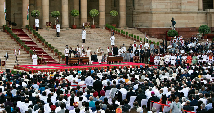 Narendra Modi takes the oath of office as India's new Prime Minister at the Presidential Palace in New Delhi on May 26, 2014. (AFP Photo / Prakash Singh) 