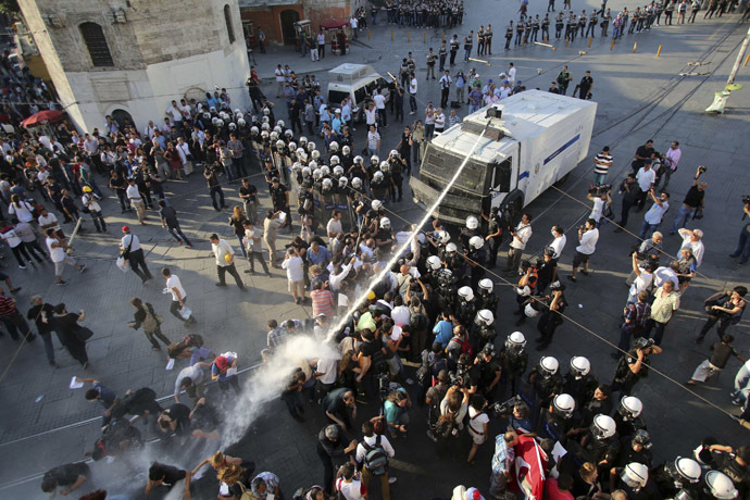 Riot police use a water cannon to disperse demonstrators during a protest at Taksim Square in central Istanbul July 6, 2013. (Reuters)