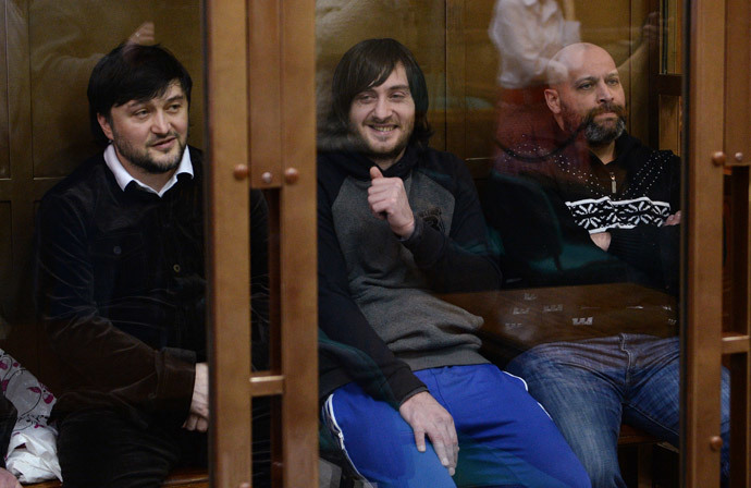 From left: Rustam Makhmudov, Ibragim Makhmudov and Sergei Khadzhikurbanov, defendants in Novaya Gazeta columnist Anna Politkovskaya murder case, during a hearing in the Moscow City Court.(RIA Novosti / Alexey Filippov)
