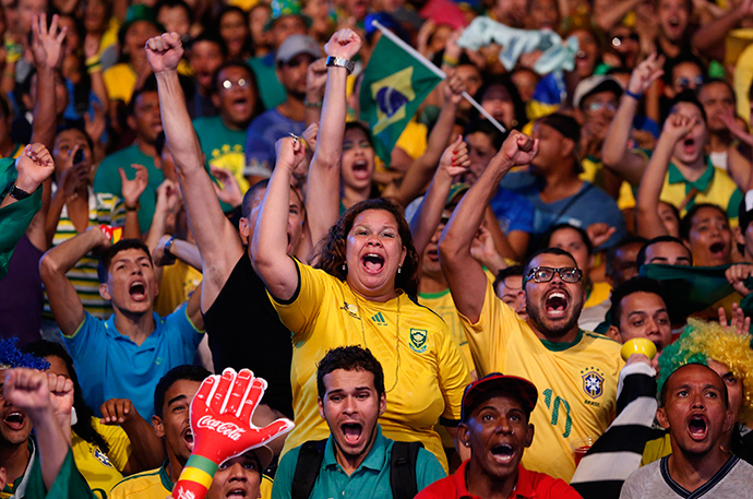 Brazilian soccer fans react while watching the opening soccer match Brazil against Croatia in a fan zone during the 2014 World Cup in Recife June 12, 2014 (Reuters / Yves Herman)