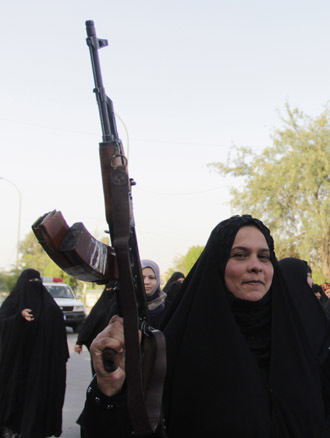 raqi Shiite women shout slogans supporting the Iraqi army in Basra, southeast of Baghdad June 19, 2014. (Reuters/Essam Al-Sudani)