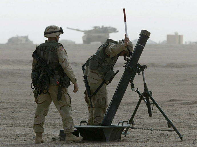 U.S. Soldiers from 2nd Battalion, 70 Armour, part of the 3rd Brigade Combat team of the 3rd Infantry Division, adjust their mortars in the northern Kuwait March 13, 2003 (Reuters)