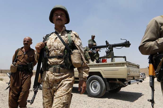 Iraqi Kurdish forces take position as they fight jihadist militants from the Islamic State of Iraq and the Levant (ISIL) on June 29, 2014 in the Iraqi village of Bashir (Basheer), 20 kilometers south of the city of Kirkuk.(AFP Photo / Karim Sahib)