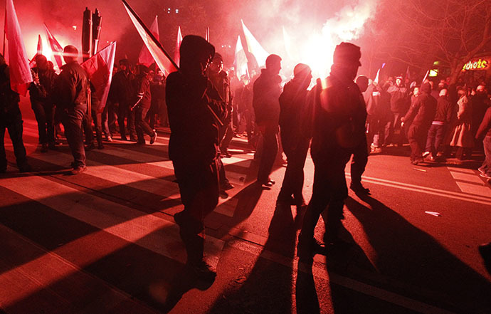 Far-right protesters walk during the annual far-right march, which coincides with Poland's National Independence Day in Warsaw November 11, 2013. (Reuters / Kacper Pempel)