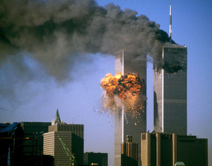 The World Trade Center south tower (L) burst into flames after being struck by hijacked United Airlines Flight 175 as the north tower burns following an earlier attack by a hijacked airliner in New York City September 11, 2001. (Reuters)