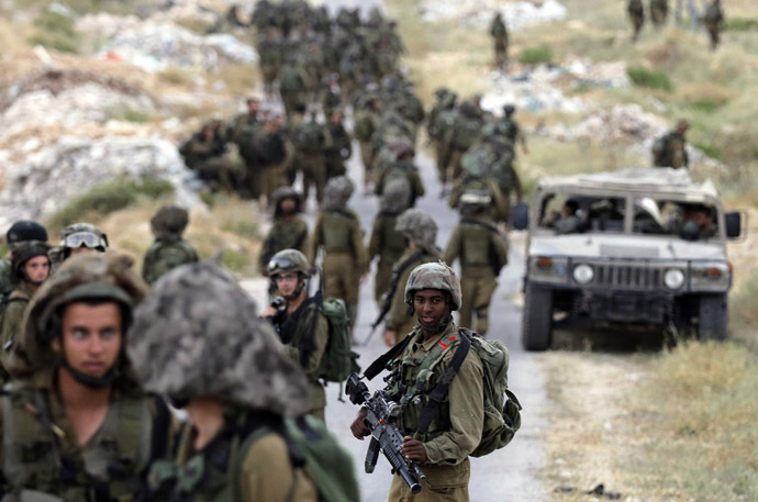 Israeli soldiers take part in an operation to locate three Israeli teens near the West Bank City of Hebron June 21, 2014. (Reuters)