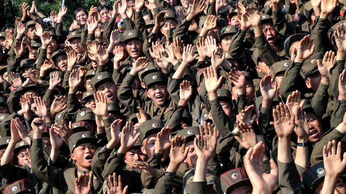 Soldiers wave during a visit by North Korean leader Kim Jong Un.(Reuters / KCNA)