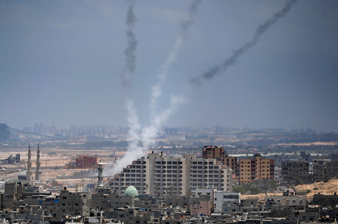 Smoke from rockets fired from Gaza City are seen after being launched toward Israel, on July 15, 2014. (AFP Photo / Thomas Coex)
