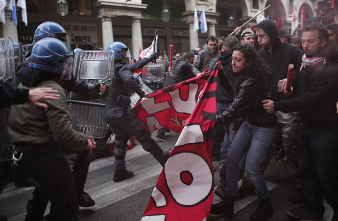 Anti-riot policemen clash with demonstrators in Turin during one of several rallies against unemployment and austerity in Italy. (AFP Photo / Marco Bertorello)