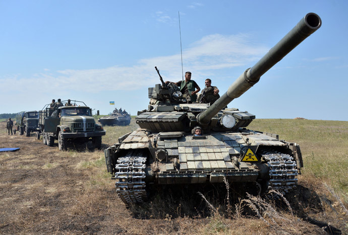A convoy of military vehicles of the Ukrainian forces drives towards the eastern Ukrainian city of Lysychansk, in the region of Lugansk, on July 25, 2014. (AFP Photo / Genya Savilov) 