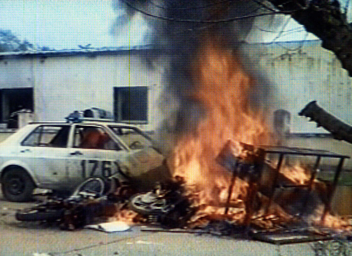 A police vehicle burns during riots in the northwestern Argentine province of Salta, November 10, 2000. Hundreds of poor and jobless Argentines put up a roadblock, set fire to a police station and looted shops after a man was shot dead and ten were injured in clashes with police. (Reuters)