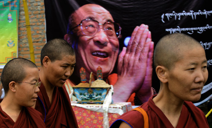 Tibetan nuns in-exile living in Nepal gather ahead of a procession during an event to mark the 79th birthday of their spiritual leader the Dalai Lama at Jawalakhel in the outskirts of Kathmandu on July 6, 2014. (AFP Photo)