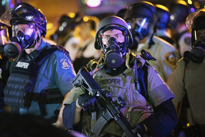 Police attempt to control demonstrators protesting the killing of teenager Michael Brown on August 18, 2014 in Ferguson, Missouri. (AFP Photo / Getty Images / Scott Olson)