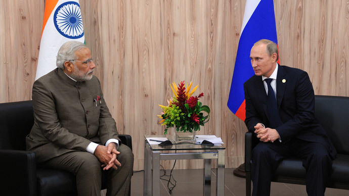 India's Prime Minister Narendra Modi (L) speaks with Russia's President Vladimir Putin during their meeting on the sidelines of the BRICS group leaders sumit in Fortaleza, Brazil, on July 16, 2014.(AFP Photo / Mikhail Klimentyev)