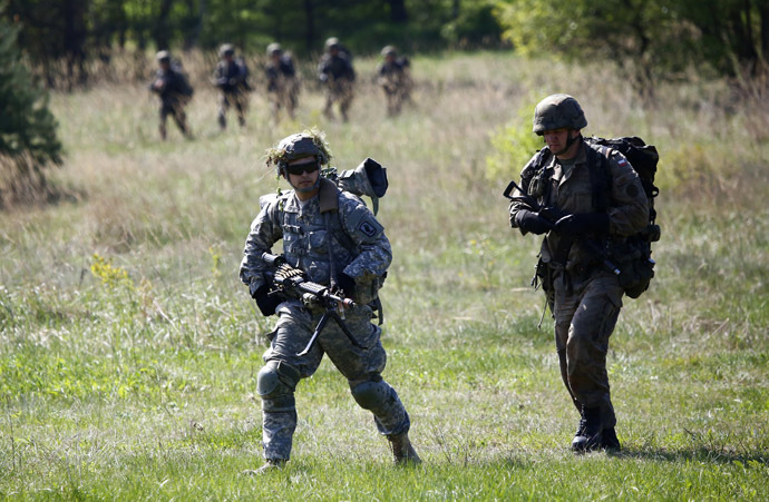 Paratroopers from the U.S. Army's 173rd Infantry Brigade Combat Team participate in training exercises with the Polish 6 Airborne Brigade' soldiers at the Land Forces Training Centre in Oleszno near Drawsko Pomorskie, north west Poland May 1, 2014. (Reuters)