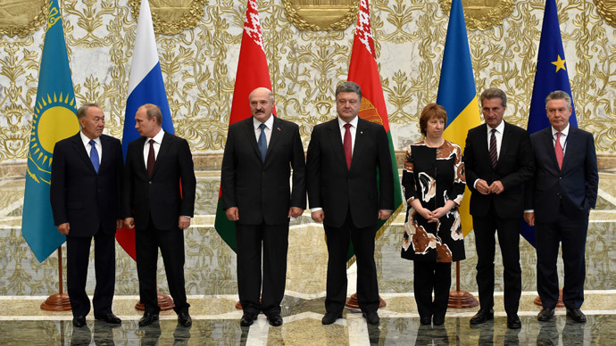 (L-R) Kazakhstan's President Nursultan Nazarbayev, Russia's President Vladimir Putin, Belarus' President Alexander Lukashenko, Ukraine's President Petro Poroshenko, High Representative of the European Union for Foreign Affairs and Security Policy Catherine Ashton, European Commissioner for Energy Guenther Oettinger, European Commissioner for Trade Karel De Gucht pose on the sideline of a summit in Belarus' capital of Minsk on August 26, 2014. (AFP Photo / Kirill Kudryavtsev)