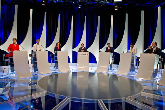 Brazilian President and candidate for the Workers' Party Dilma Rousseff (L), and presidential candidates, for the Green Party Eduardo Jorge (2-L), for the Socialism and Freedom Party Luciana Genro (3-L), for the Brazilian Social Democracy Party Aecio Neves (3-R), for the Brazilian Socialist Party Marina Silva (2-R) and for the Social Christian Party Pastor Everaldo (R), attend the second television debate in Sao Paulo, Brazil on September 1, 2014.(AFP Photo / Nelson Almeida)