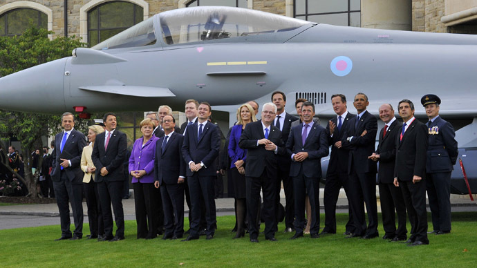 NATO leaders watch a fly-past by the Red Arrows during the NATO summit at the Celtic Manor resort, near Newport, in Wales September 5, 2014. (Reuters/Rebecca Naden)