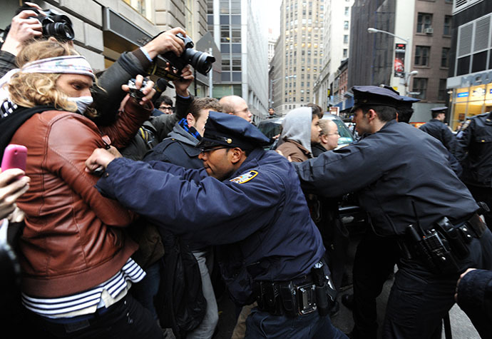New York Police Department officers push back people as demonstrators with 'Occupy Wall Street' mark the two month anniversary of the protest November 17, 2011 in New York. (AFP Photo / Stan Honda)