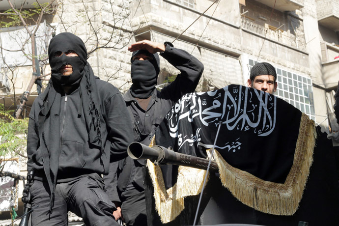 Members of jihadist group Al-Nusra Front take part in a parade calling for the establishment of an Islamic state in Syria, at the Bustan al-Qasr neighbourhood of Aleppo, on October 25, 2013. (AFP Photo)