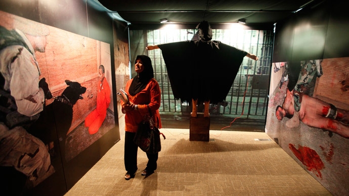 A life-size mannequin called "Man in the Hood" is displayed at the "War Is A Crime" exhibition in Kuala Lumpur November 19, 2011. The week-long exhibition, organized by Perdana Global Peace Foundation, recreated scenes from the infamous Abu Ghraib prison in Iraq with life-size mannequins of prisoners, and violent images from the Iraq, Afghanistan and Vietnam wars. According to the organizers, the exhibition seeks to educate the public on the consequences of war.(Reuters / Bazuki Muhammad)