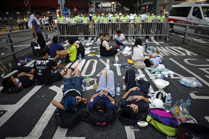 Protesters block a street near government headquarters in Hong Kong September 30, 2014. (Reuters/Carlos Barria)
