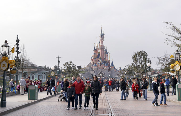 People visiting the Disneyland park in Chessy, near Marne-La-Vallee, outside Paris. (AFP Photo / Thomas Samson)