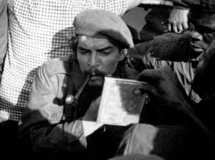 Picture taken 21 November 1965 of Argentine-born guerrilla leader Ernesto "Che" Guevara (aka Tatu -number 3 in swahili) shaving on board a barge while crossing the Tanganika Lake from the then Congo Leopoldville (Belgian Congo) to Tanzania, during the withdrawal of forces after a failed campaign in Congo. (AFP Photo)