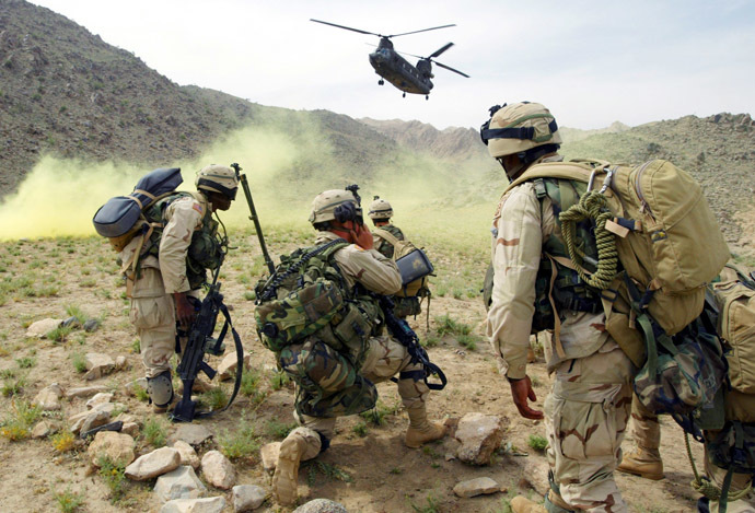 American soldiers prepare to board a helicopter after Operation Deliberate Strike, some 60 km (37.5 miles) north of Kandahar, Afghanistan, May 20, 2003. (Reuters/Kamal Kishore)