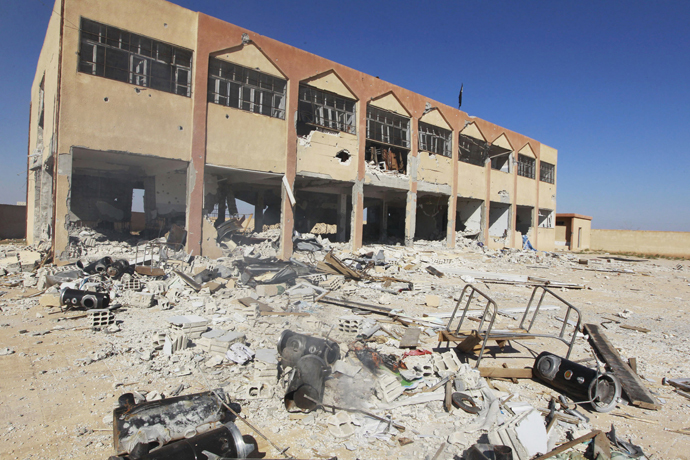 A damaged school building, which was used by Kurdish fighters as a base, is seen in al-Aziza village in the countryside of the Syrian Kurdish town of Kobani, after the Islamic State fighters took control of the area October 7, 2014. (Reuters/Stringer)